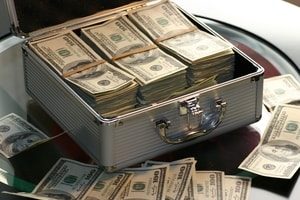 Money in a suitcase. Pomona Title Loans