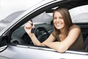 Girl in car with car keys. Title Loans City of Industry