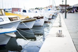 Sea dock with boats waiting. San Mateo Title Loans