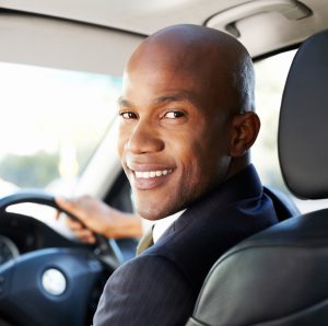 Man inside car smiling